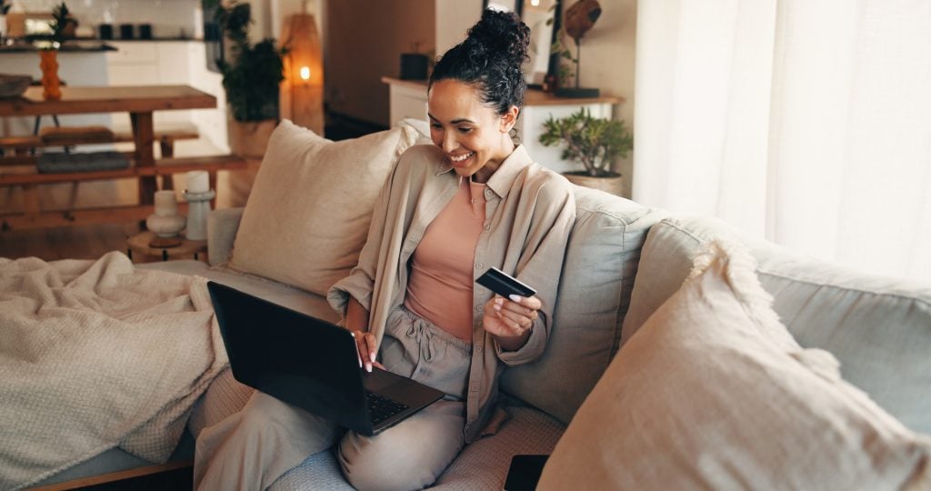 Alabama resident managing bills and online banking on a laptop at home