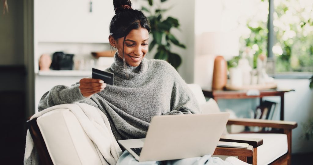 Louisiana resident using online banking on a laptop at home