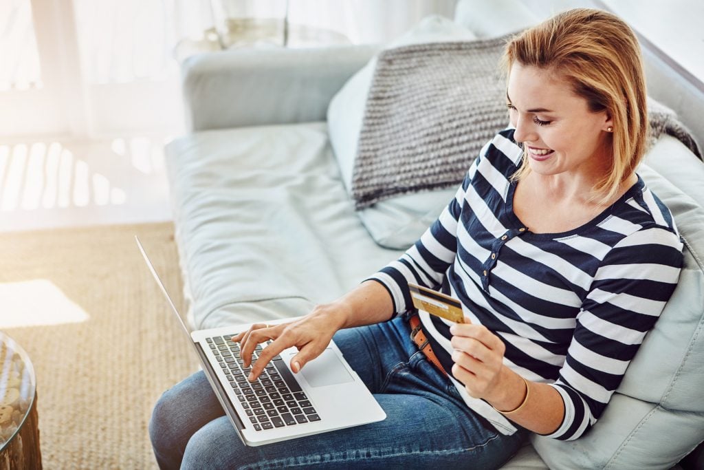 Mississippi resident applying for an online loan on a laptop at home